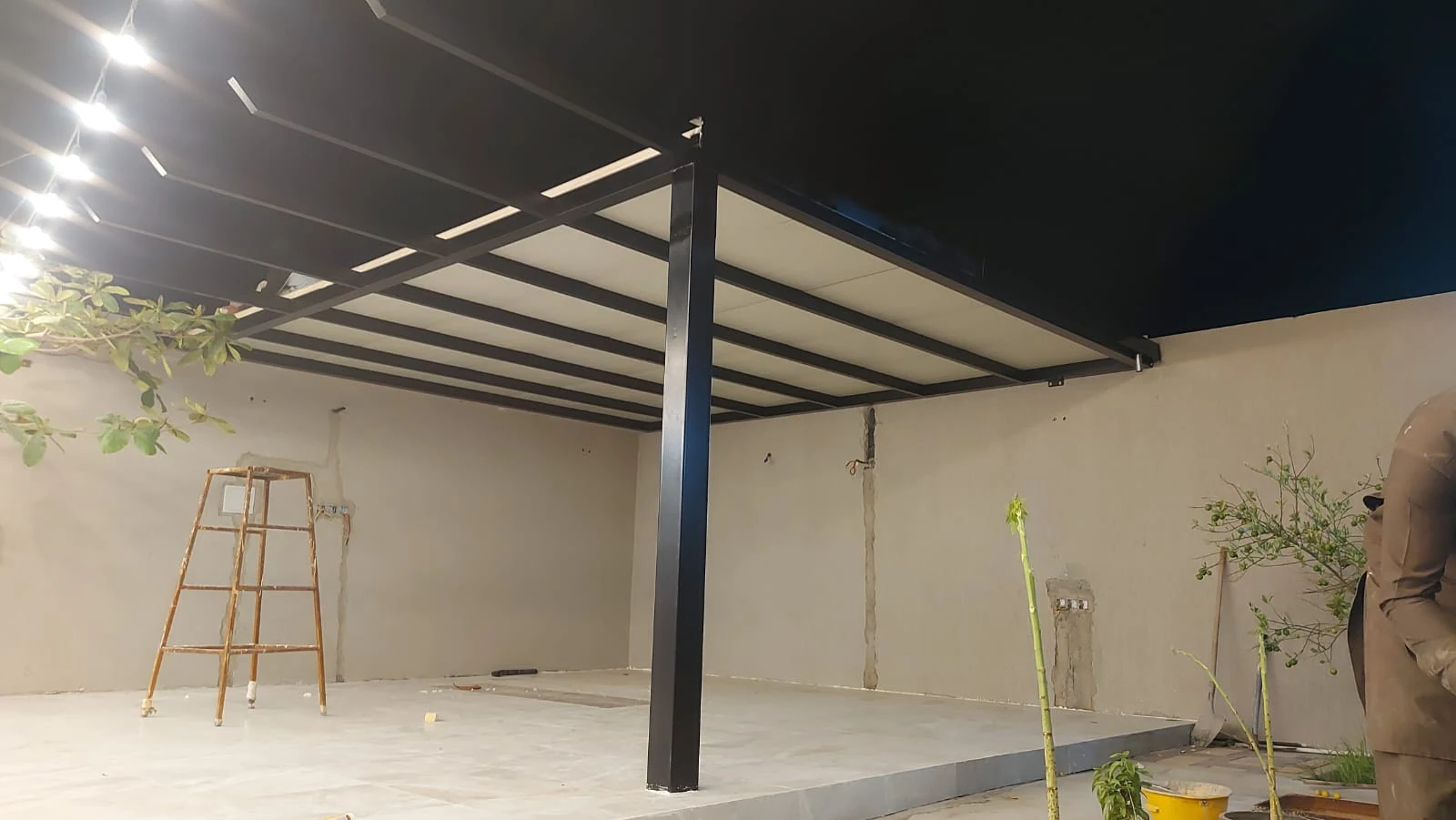 Metal canopy structure with lighting