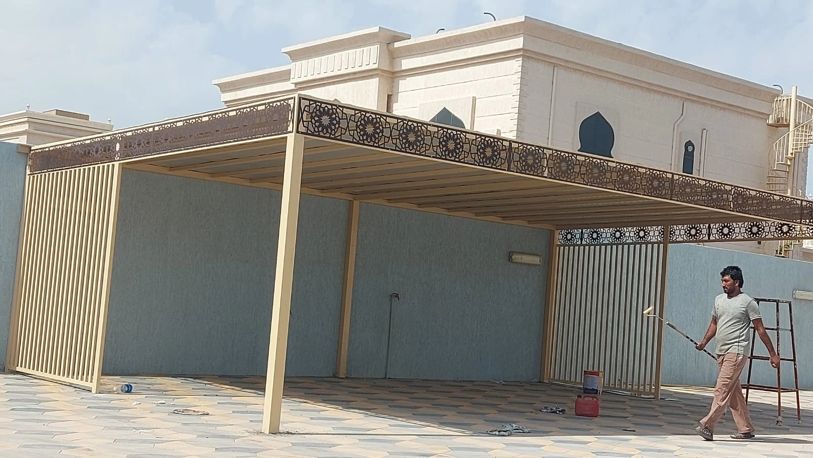 Car parking canopy beside a villa