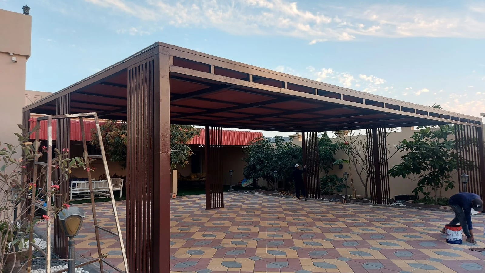 Wide metal canopy in a courtyard
