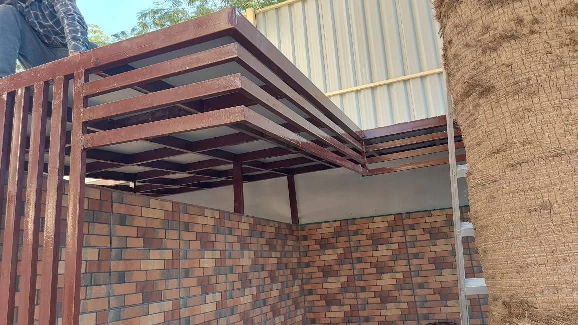 Metal canopy with architectural slats