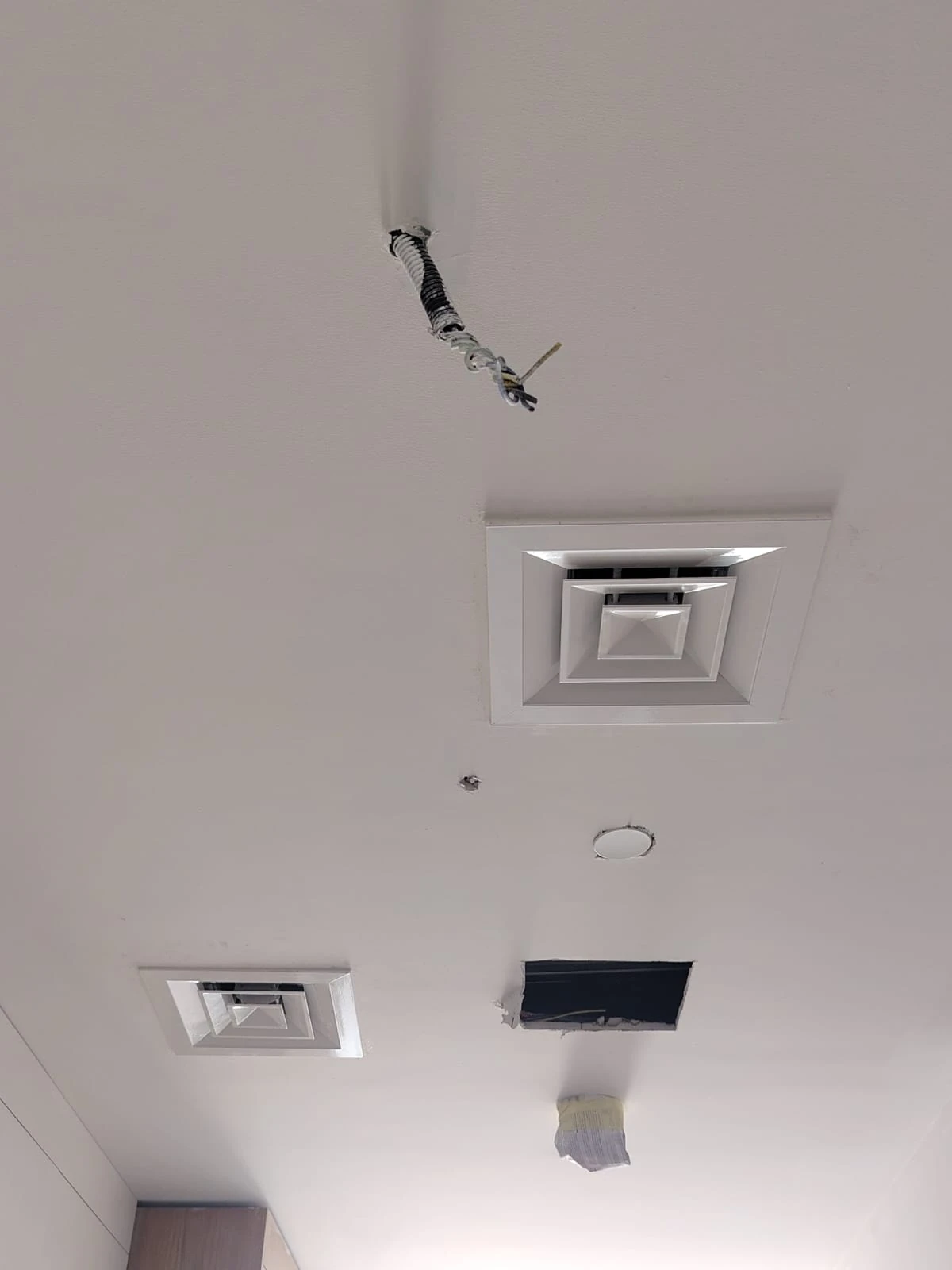 Ceiling detail showing finishing preparation around service openings