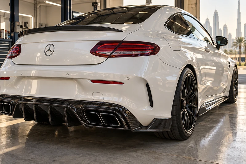 Rear diffuser and side-skirt bodywork detail on a Mercedes AMG coupe