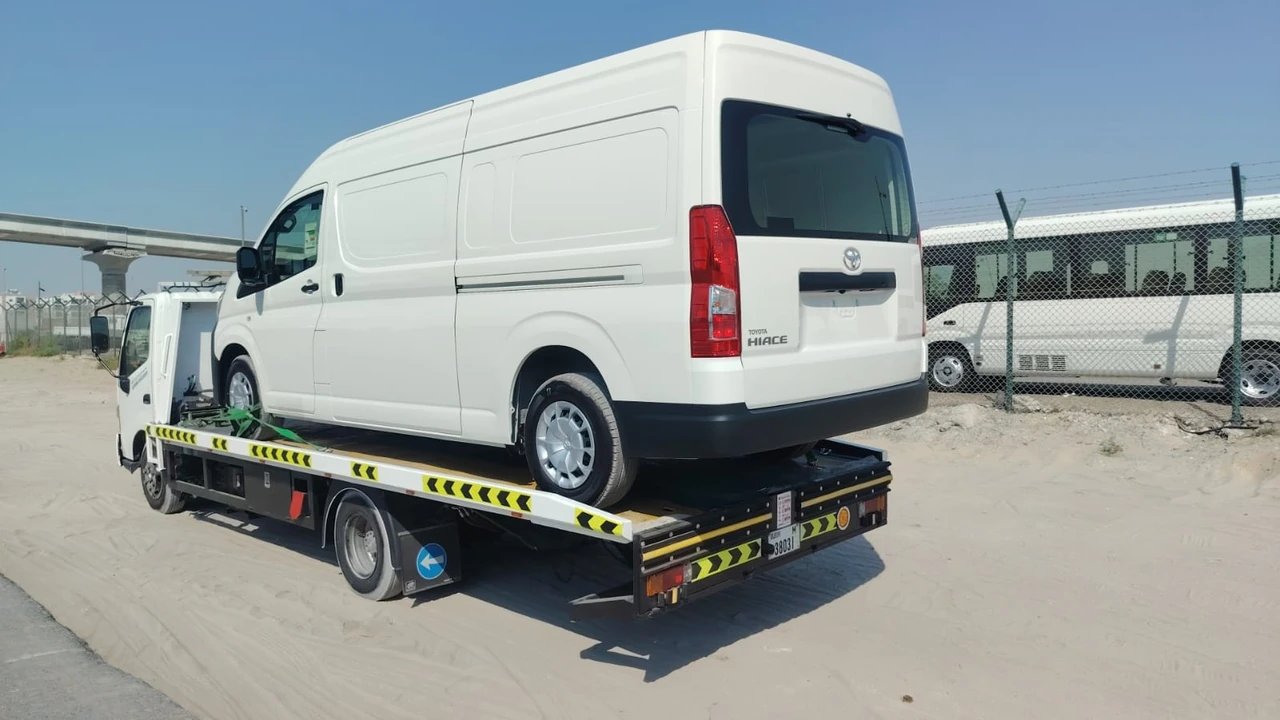 Van transported on a flatbed truck