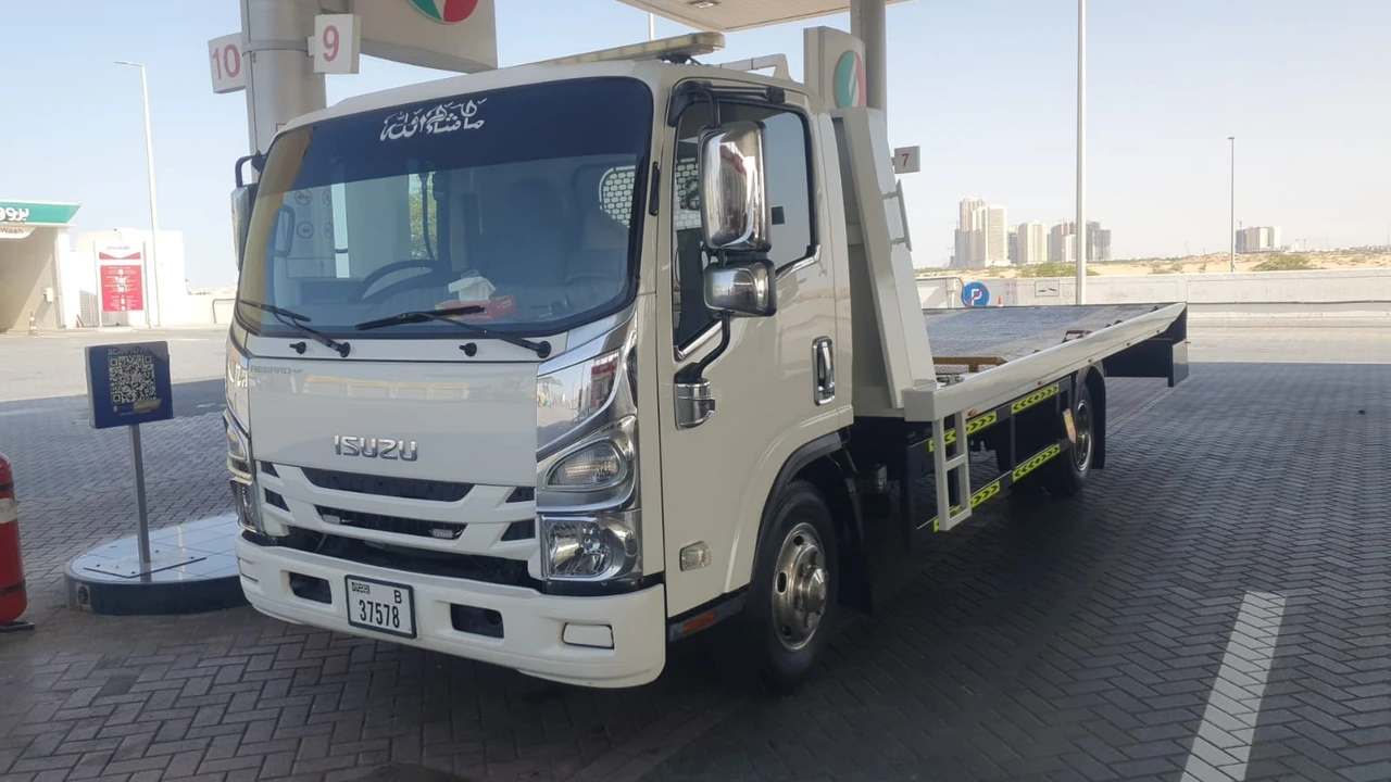 Recovery truck parked beside a road