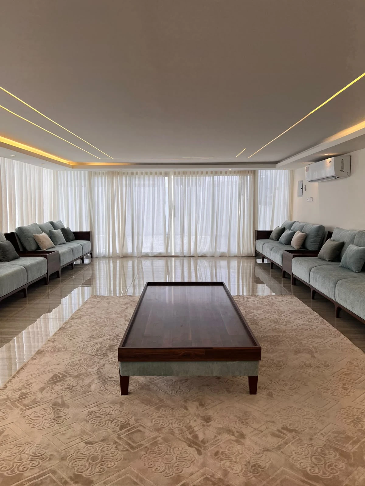 Client-supplied furniture and carpet room photograph